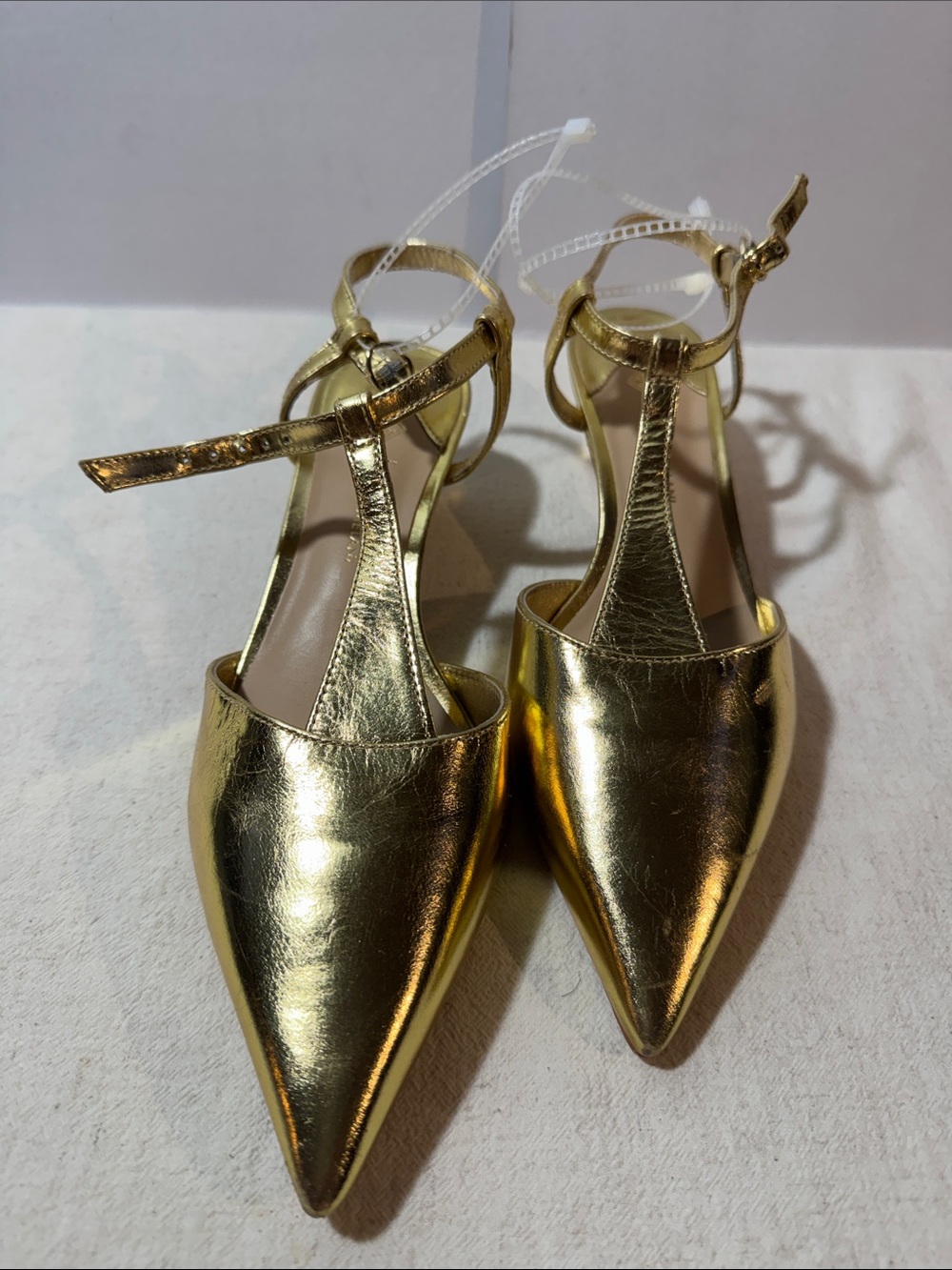 ANTONIO MELANI Gold Pointed T-Strap Heels. Leather sole